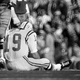 Legend Johnny Unitas looking beaten down.